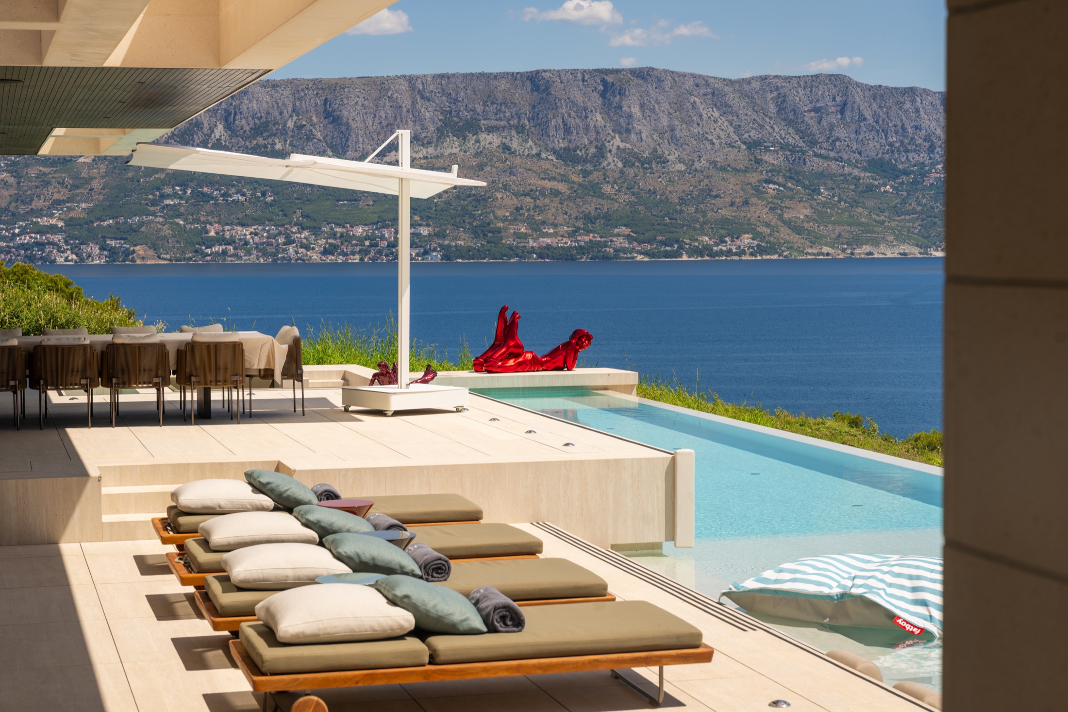 Private sun terrace beside the pool at Villa Perez